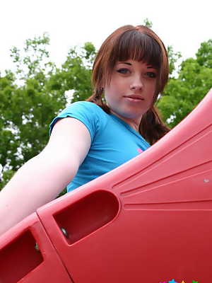 Pigtailed ginger Barbie flashes her perky tits at the playground