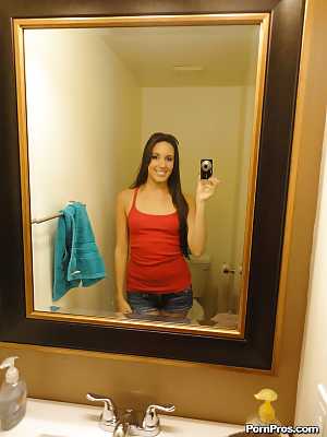 Teen babe Bailey Bam strips by the mirror and makes amateur shots