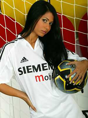 Football playing girl with dark hair Radka N strips to socks and cleats in net