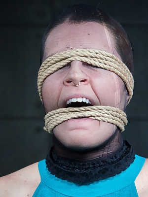 Redhead sex slave Barbary Rose is restrained by ropes during BDSM play