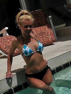 Cute blonde MILF Barbi Sinclair shows her fantastic body wearing sexy bikini in the pool.