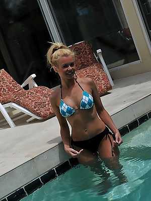 Cute blonde MILF Barbi Sinclair shows her fantastic body wearing sexy bikini in the pool.