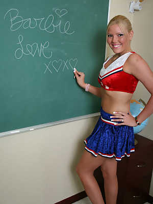 Sexy chick Barbie Love poses in the classroom in her cheerleading outfit