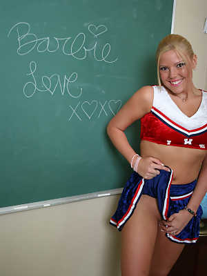 Sexy chick Barbie Love poses in the classroom in her cheerleading outfit