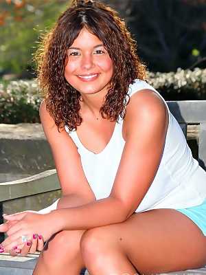 Amateur girl Becca Stein sports curly hair during a non nude shoot at the park