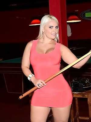 Curvaceous blonde MILF reveaaling her goods and posing on the pool table