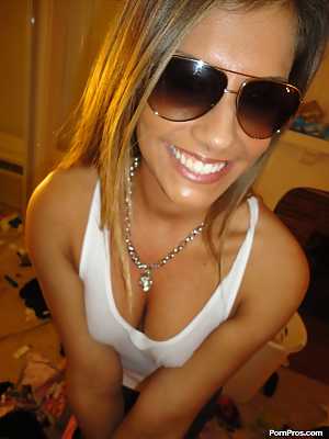 Sassy teenage babe Bella Beyle puts on her glasses and takes sexy selfies