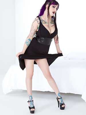 Clothed & inked goth girl hikes her black dress to reveal pierced pussy