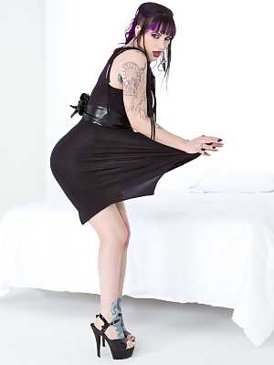 Clothed & inked goth girl hikes her black dress to reveal pierced pussy