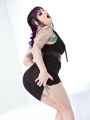 Clothed & inked goth girl hikes her black dress to reveal pierced pussy