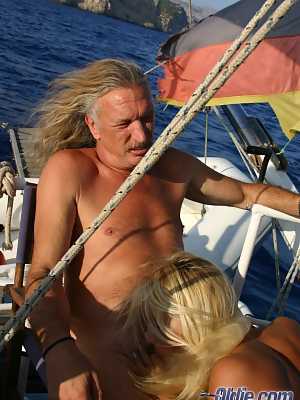 Beautiful young blond Melissa Black fucks an old man while sailing on his boat