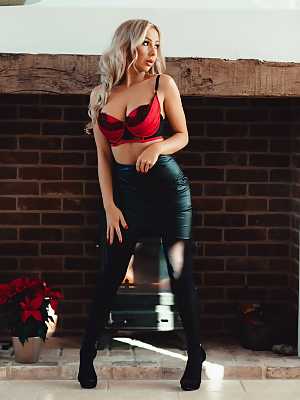 Platinum blonde Beth Morgan unleashes her big boobs in black stockings