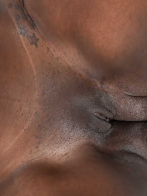 Ebony fatty Black Dahlia is proud of her chocolate brown body and bald twat