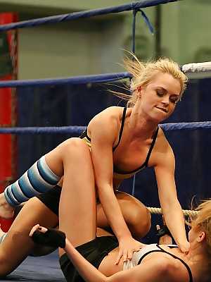 Pretty lesbians gasping and stripping each other in the wrestling ring