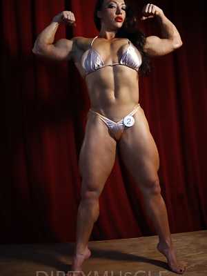 Female bodybuilder Brandi Mae exposes herself while flexing on a platform