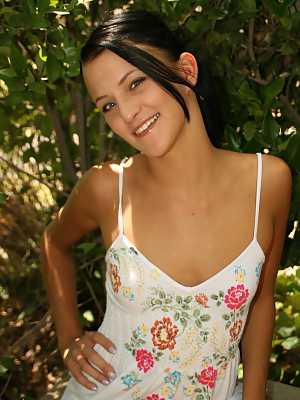 Brunette amateur Brandy Bates gets totally naked while in a backyard