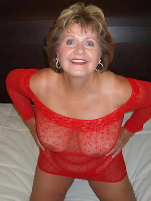 Older woman BustyBliss shows off her natural tits in and out of lingerie