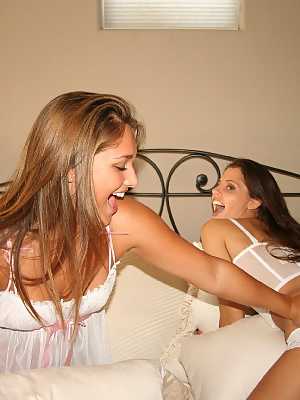 Young lesbians Lili Jensen & Cali Logan hump each other in white lingerie