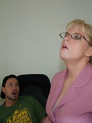 Smoking mature blonde in glasses gets a cumshot on her big tits