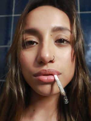 Attractive teen Camila Luna shows her amazing boobs & booty while smoking
