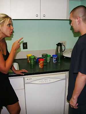 Slutty blonde with massive bosoms gives a great handjob in the kitchen