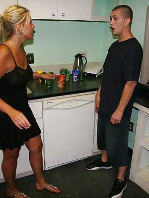 Slutty blonde with massive bosoms gives a great handjob in the kitchen