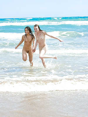 Amateur models Carly T and Silvie bare naked teen bodies at the beach