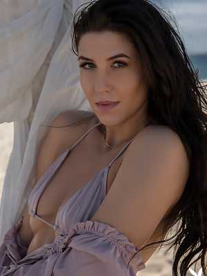 Small breasted brunette Carmen Nikole reveals sweet natural tits at the beach