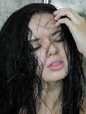 Dark-haired beauty Carmen Summer takes a shower in a sensual manner