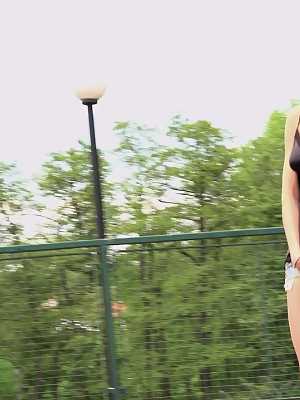 Blonde girl Carol Lilien pulls down her cutoffs for a piss on a wooden walkway