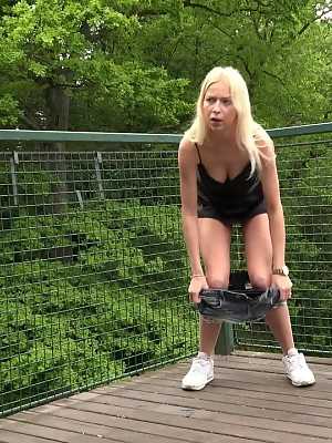 Blonde girl Carol Lilien heads up to a deck for a piss due to bathroom repairs