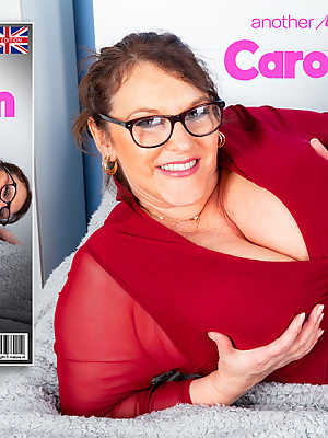 Overweight woman Carol Brown unveils her huge boobs and big butt on a bed