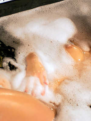 Dirty blonde Carrie Minter touches her goodies during bubble bath