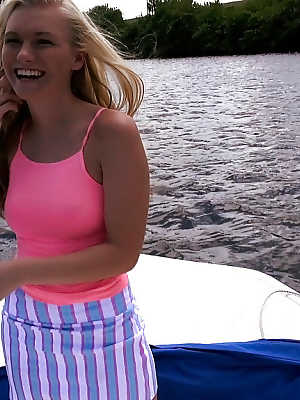 Blonde solo girl Cassidy Ryan revealing small tits outdoors on boat