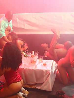 Hot black girls take on white and black cocks during group sex at a party