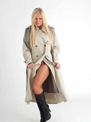 Platinum blonde chick Charlie G removes an overcoat to model lingerie in boots