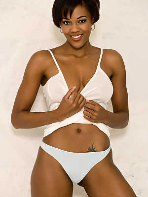 Short haired ebony girl in white Chernise Yvette flaunts her natural tits