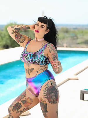 Inked fatty Cherrie Pie loses her bra and undies and flaunts her hot curves