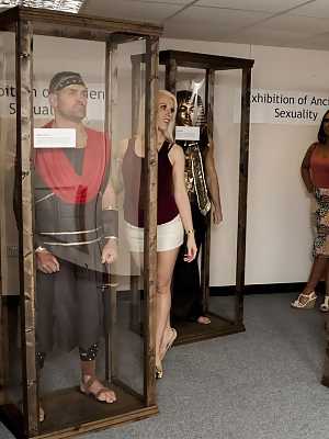 Dressed up hotties watch handsome naked men masturbate at the museum