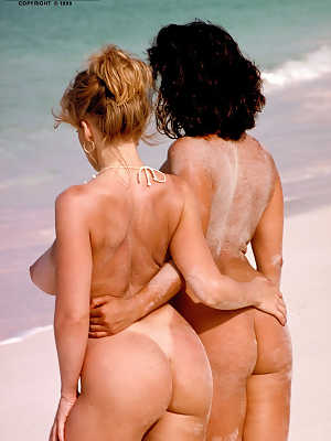 Euro MILF Chloe Vevrier and big boobed gf make lesbian love on sandy beach