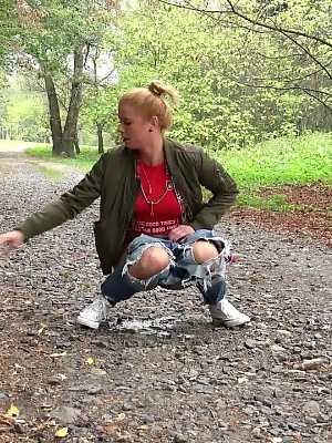 Blonde babe Chrissy relieves herself on a path