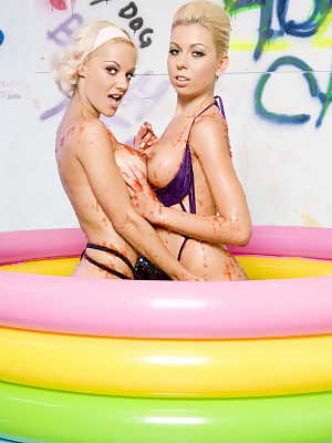 Blonde hotties Lou Lou and Christine Love flaunt their fakes in a small pool