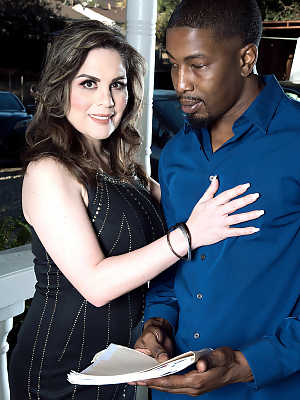 Busty woman Ciara Ryder exposes her thong while seducing a black man