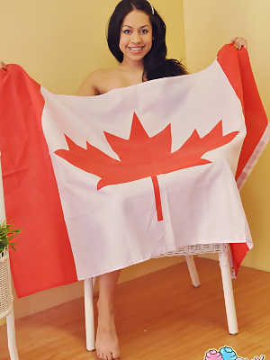 Cute Canadian teen Cindy Cupcakes holds a flag before showing her naked body