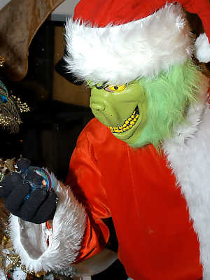 Big boobed blonde chick gets banged by the Grinch in a Santa suit at Christmas