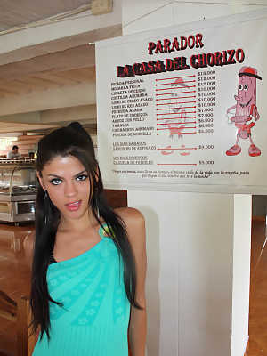 Tempting young teen Latina Claudia Castro eats a sausage provocatively