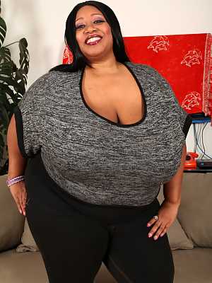 Ebony BBW Cotton Candi lets out her huge boobs in solo action on the floor