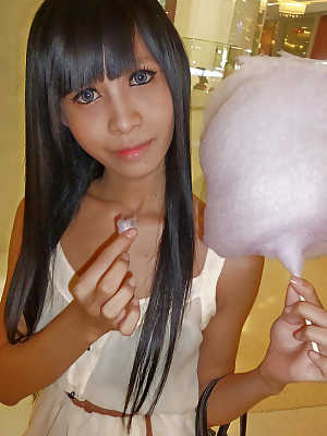 Cute Asian tranny Noot eating cotton candy and posing in high heels