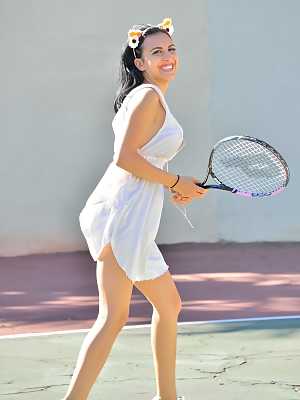 Dark haired babe Saraya shows her lovely boobs and poses on a tennis court