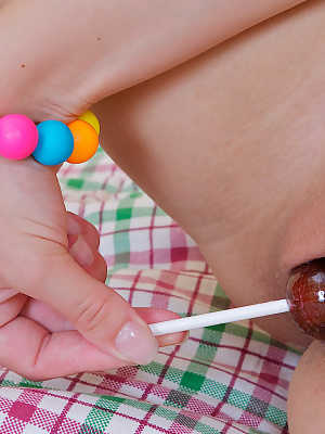 Sucking a lollipop makes cute teeny so horny she ends up fucking herself with